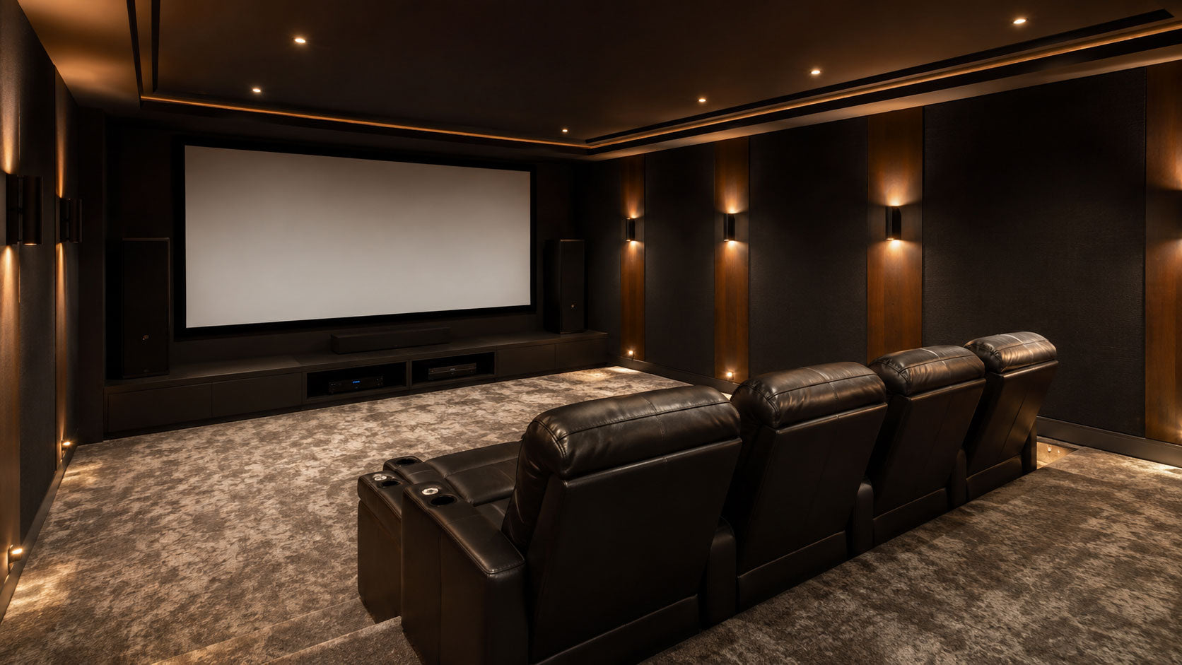 Organized home theater room with screen wall and recliner seating