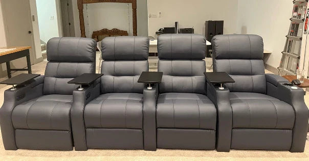 Four-seat home theater recliners with tray tables in a bright room