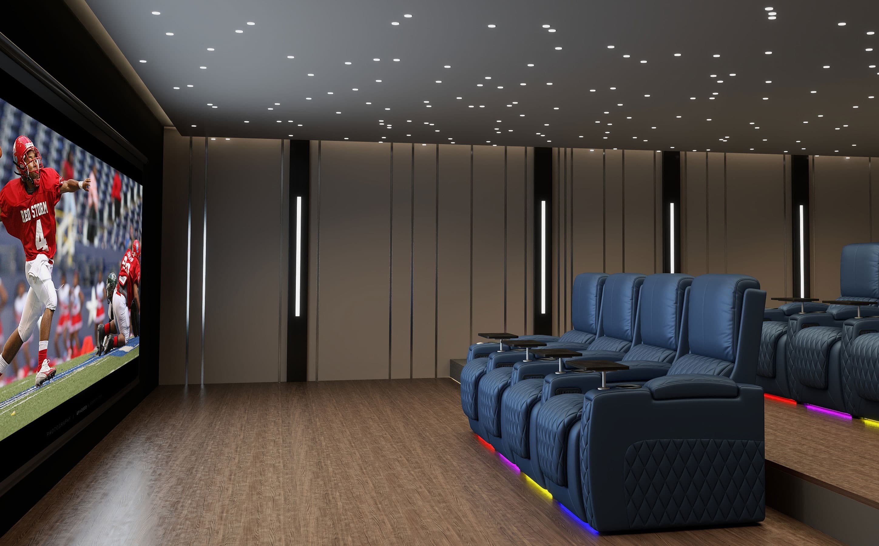 Blue home theater seating with power recliners, tray tables, and RGB LED lights in a modern home cinema room