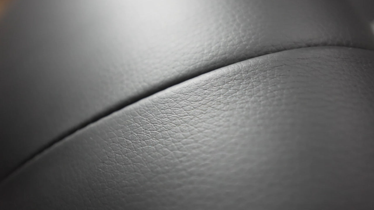 The leather appears to have a quilted pattern, and the image captures the details of the stitching and the softness of the material.