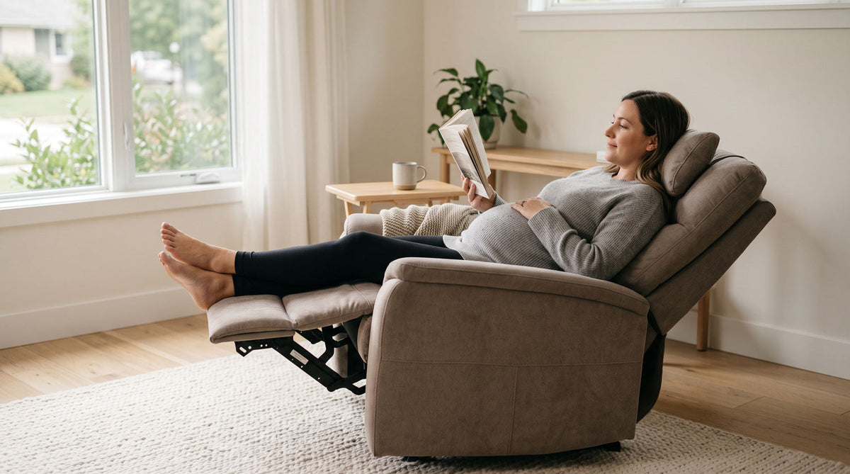Pregnant woman relaxing in a zero gravity recliner in living room