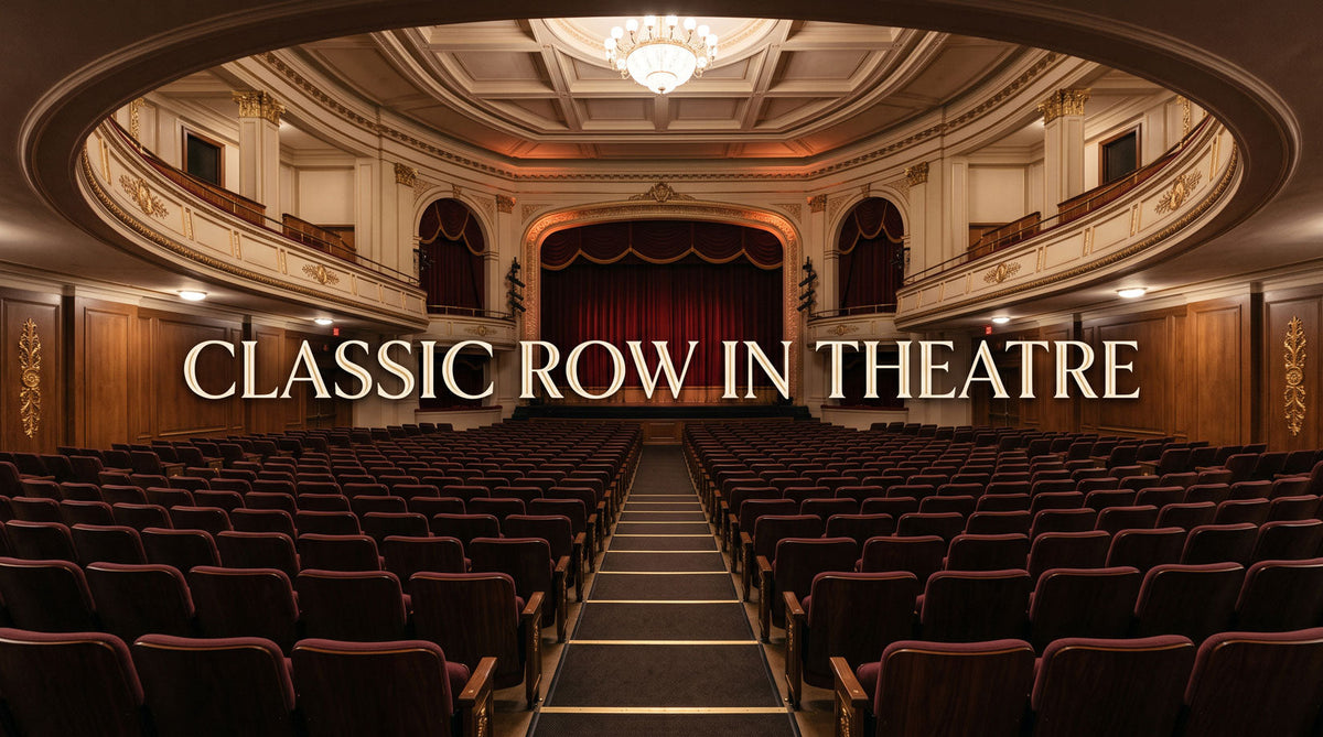 Classic row in theatre with traditional forward-facing seats and a centered stage