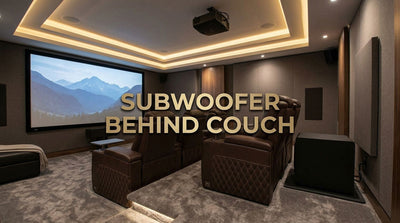 Subwoofer positioned behind a row of home theater recliners with safe seating clearance