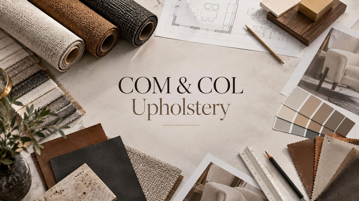 COM and COL upholstery materials with fabric, leather samples, and furniture specification documents.