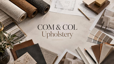 COM and COL upholstery materials with fabric, leather samples, and furniture specification documents.