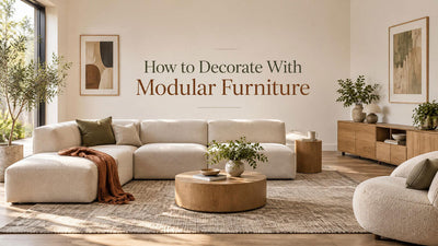 Cream modular sofa with olive and rust accents, small oak tables, and low storage in a coordinated living room