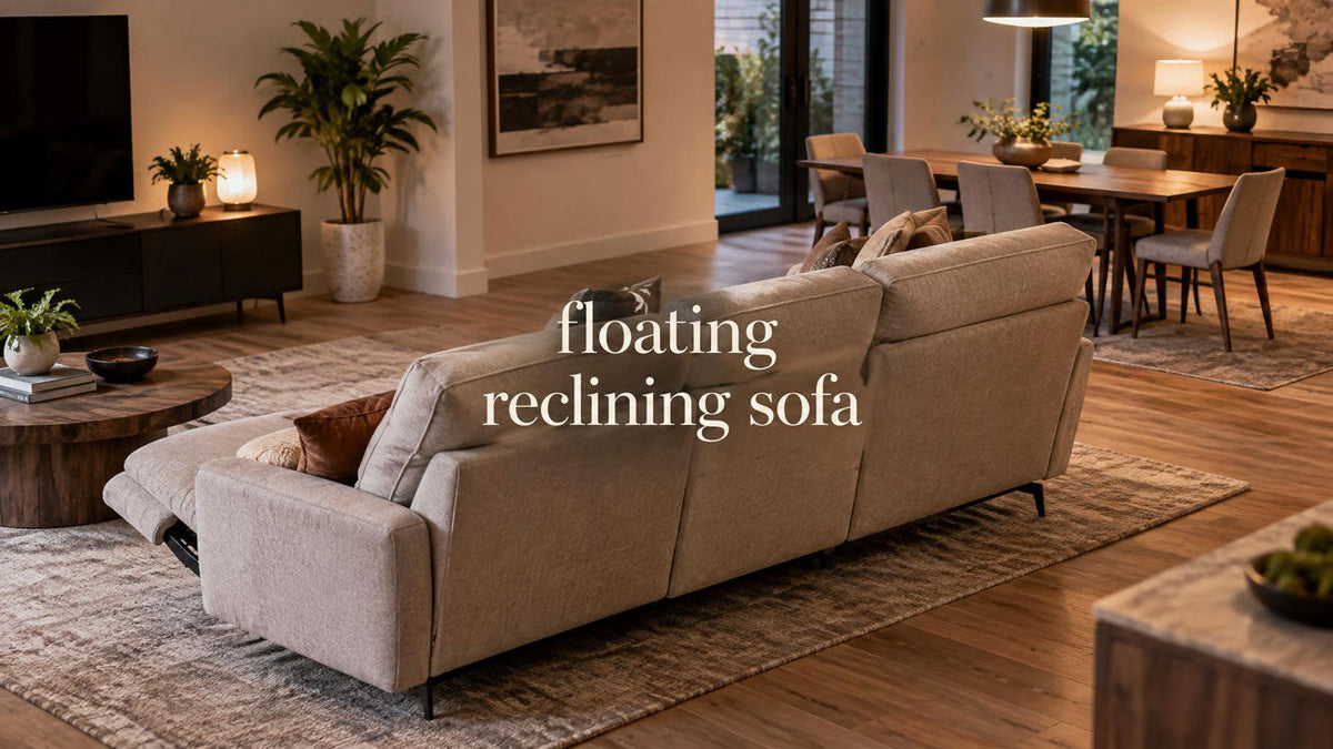 Reclining sofa positioned away from the wall in an open-plan living room with a clear route behind it.