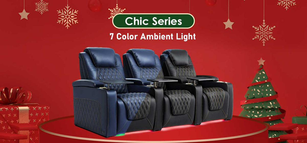 A promotional image for a "Luxury Series" home theater seating collection showing three power recliners in a holiday-themed setting.