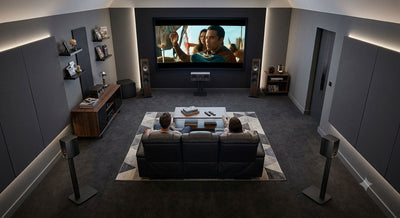 Wireless home theater setup with surround speakers and comfortable seating