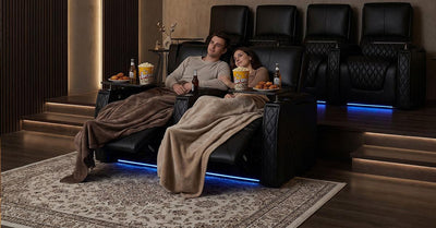 Living room with carpet flooring and a wall-mounted home theater setup