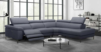 L shaped leather sectional with matching ottoman in a modern living room