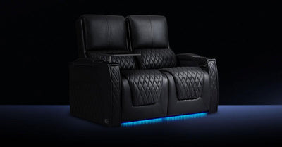 Black two-seat home theater recliner with blue LED base lighting