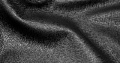 Smooth black leather texture close-up for upholstery material