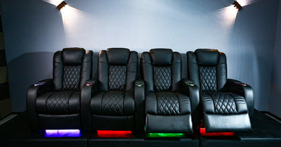 Black leather home theater recliners with quilted backrests and multicolor LED lighting 