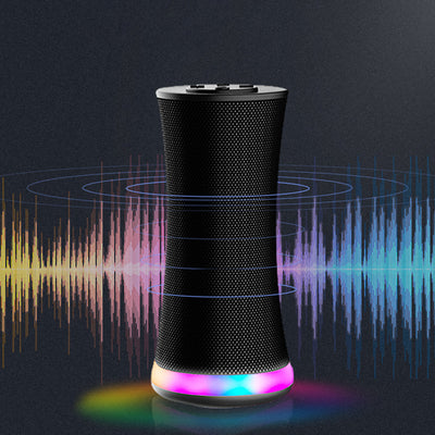 A smart speaker or wireless audio device with a sleek, hourglass-shaped design. 