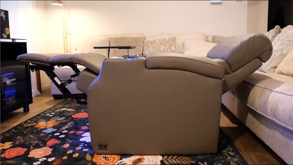 Power recliner fully extended with footrest and headrest in modern living room