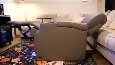 Power recliner fully extended with footrest and headrest in modern living room
