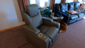 Gray home theater recliner with quilted leather and gold LED cup holders in living room