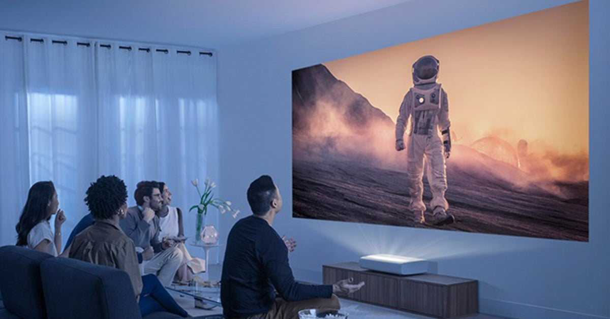 Family watching movie with ultra short throw projector in living room