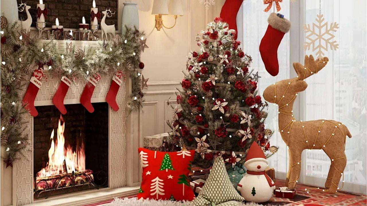 A festively decorated living room features a Christmas tree adorned with red and white ornaments, flanked by stockings hung from the fireplace mantel, a reindeer figurine, and wrapped presents, creating a warm and inviting holiday atmosphere.