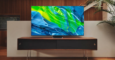 Modern 4K OLED TV on minimalist console in stylish living room.