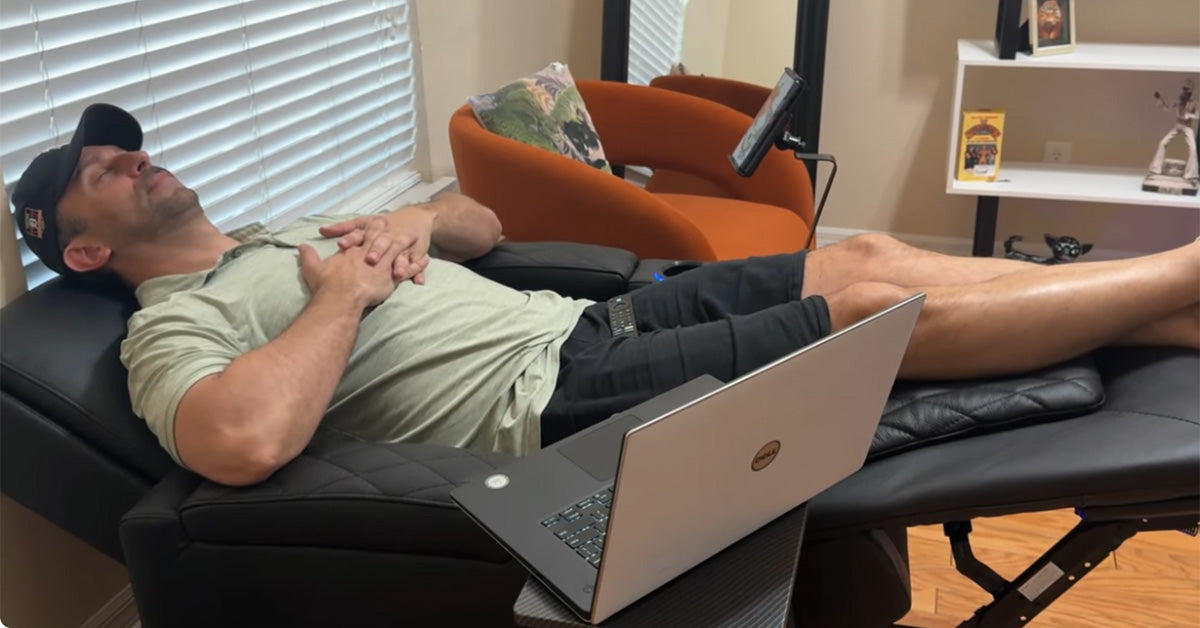 Tall man using a recliner