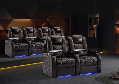 a home theater or cinema room with several high-end reclining leather chairs arranged in rows